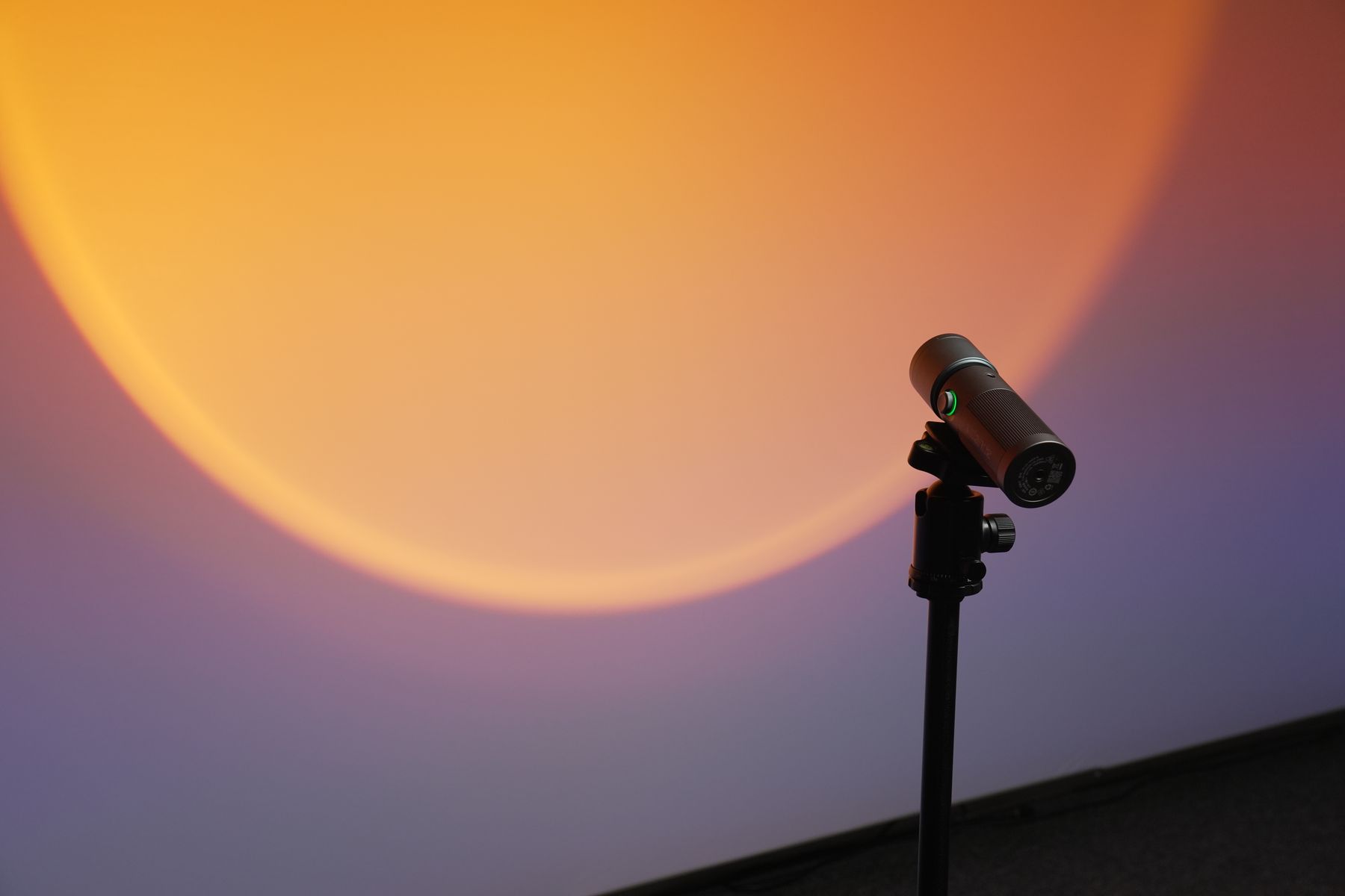 Sunset light projector glowing on the backlit wall at Podcast Corner Dubai